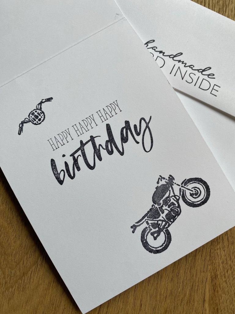 inside of motorcycle
cards with happy (x3) birthday and envelope behind that says handmade card inside